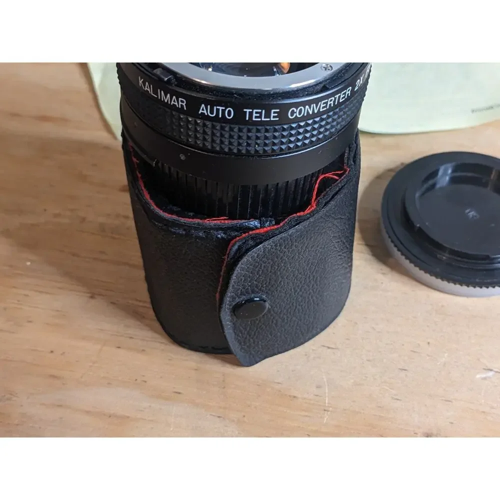 Nikon EM Black body 50mm Series E + Auto Tele Converter + Bag + Kalimar Light +